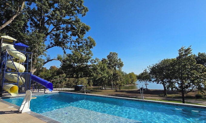 Grove House | Giant10-bedroom lakefront home with large pool, hot tub, and dock