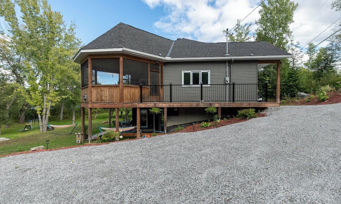 Bouchette Ski Chalet | Modern Lakefront Chalet with Games Room, Gym, Wrap Around Balcony & Scenic Views