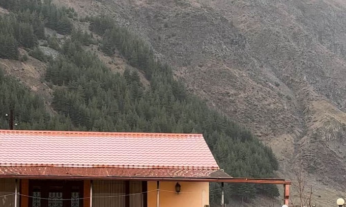 Kazbegi House | A Private Guest House in a secluded area by the river, surrounded by mountains.