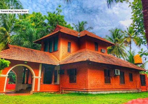 Ramanagara Villa | Ambara Kovilakam Private Pool Villa by Travent Mug